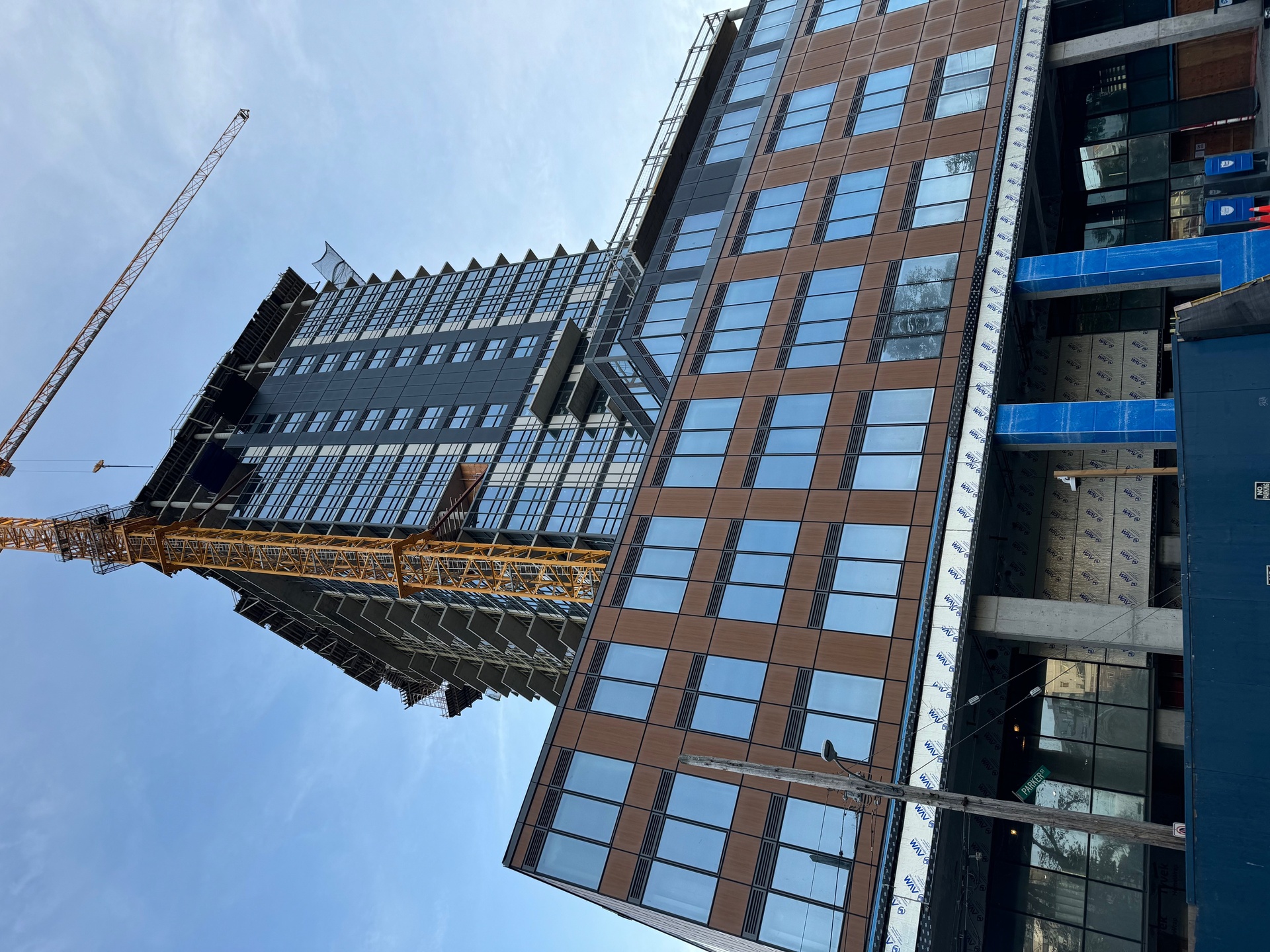 Crane next to a tall apartment building